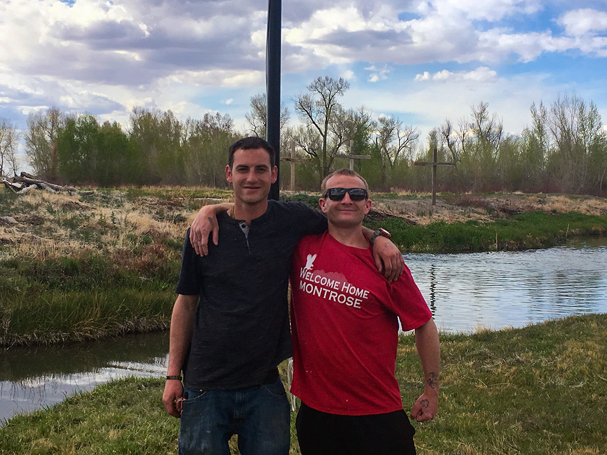 Inpatients in front of crosses at our christian rehab center