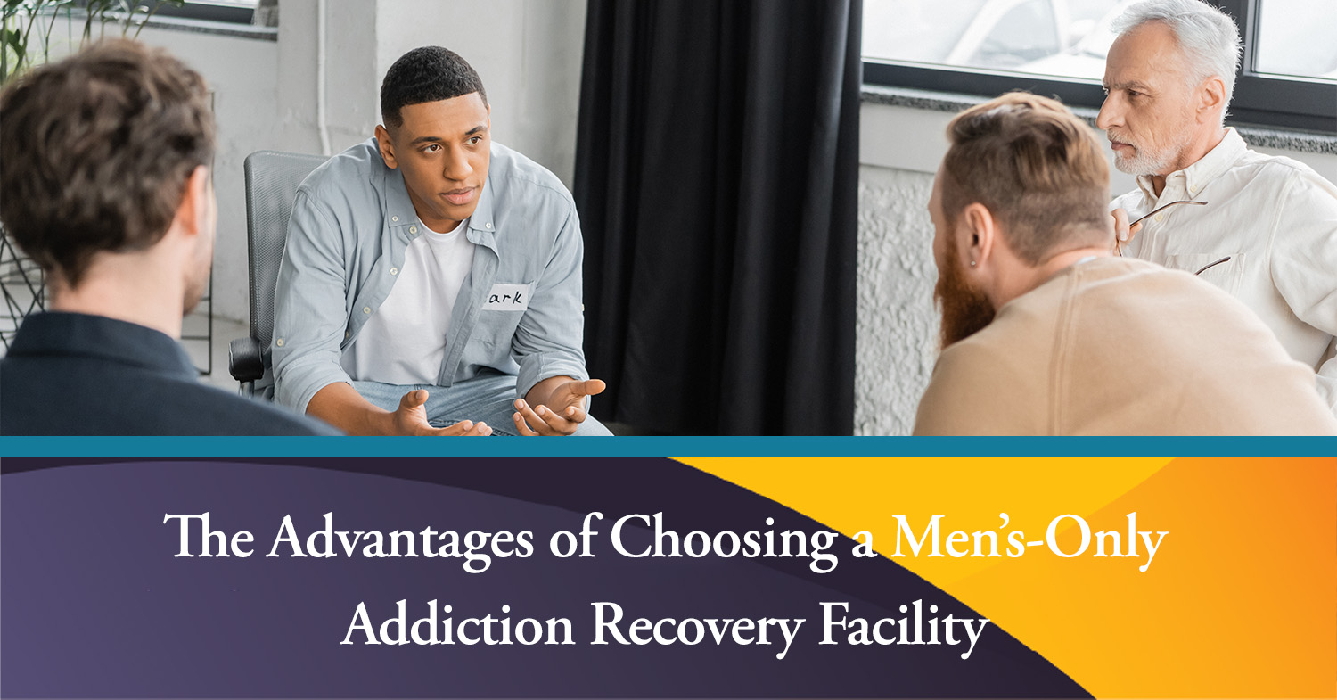 A group on men in a men's-only addiction recovery facility having group therapy.